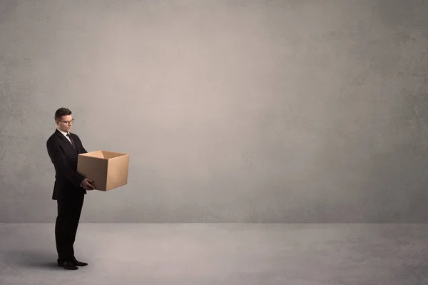 Businessman with empty box — Stock Photo, Image