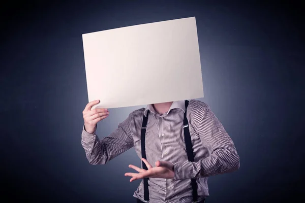 Businessman holding blank paper — Stock Photo, Image