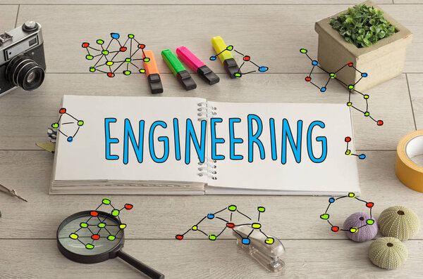 Excercise-book on the floor and isntruments nearby