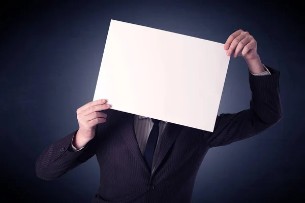 Businessman holding blank paper — Stock Photo, Image