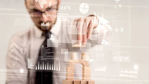 Businessman building a tower — Stock Photo, Image