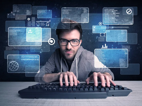 Nerd with glasses hacking websites — Stock Photo, Image