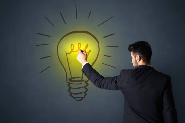 Businessman with lightbulb — Stock Photo, Image