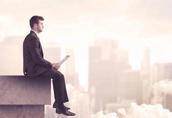 Peaceful sales guy sitting on roof top — Stock Photo, Image