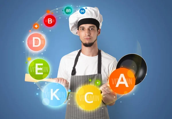 Cozinheiro bonito com conceito de vitamina — Fotografia de Stock