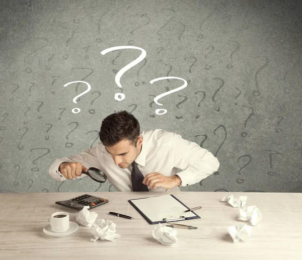 Businessman at desk with question mark — Stock Photo, Image