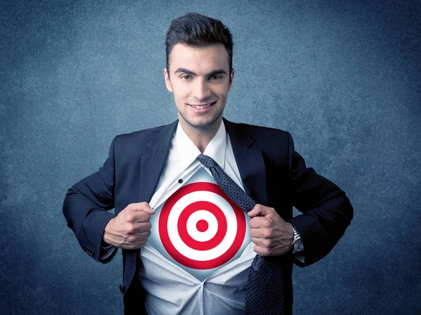 Businessman tearing shirt with target sign on his chest — Stock Photo, Image