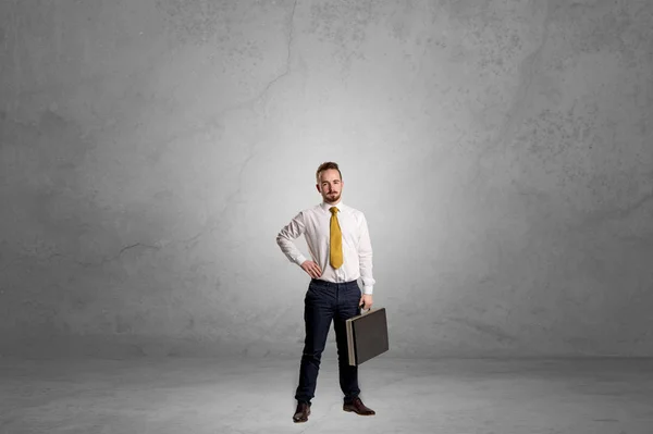 Alone businessman standing in a dark room — Stock Photo, Image