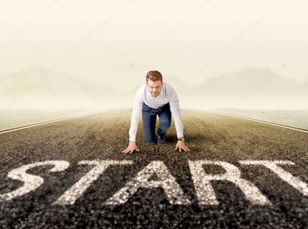 Businessman at start line