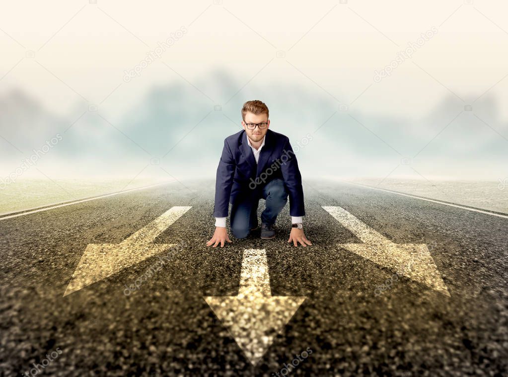 Businessman kneeling in ready position