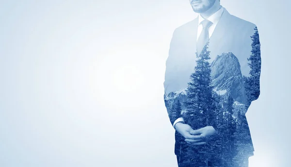 Businessman standing with mountain — Stock Photo, Image