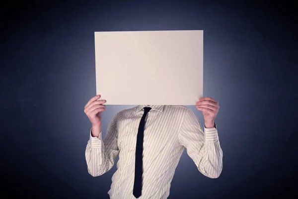 Businessman holding blank paper — Stock Photo, Image