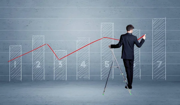 Man drawing chart from ladder — Stock Photo, Image