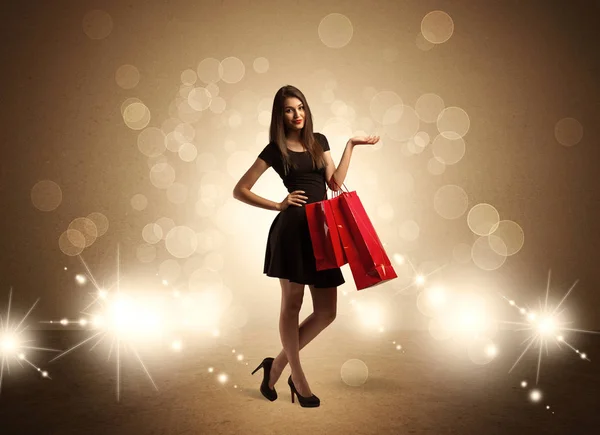 Shopping lady con borse in luci brillanti — Foto Stock