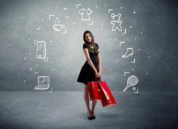 Mujer de compras con bolsos e iconos dibujados —  Fotos de Stock