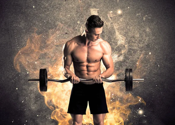Saludable macho caliente mostrando músculos con fuego —  Fotos de Stock