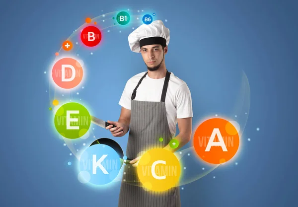 Handsome cook with vitamin concept — Stock Photo, Image