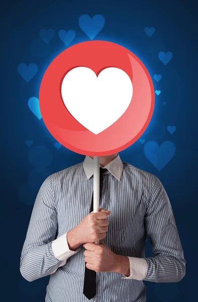 Businessman holding heart sign — Stock Photo, Image