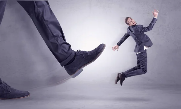 Foot kicking, businessman flying — Stock Photo, Image
