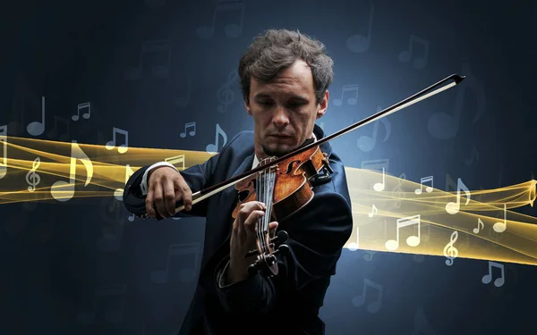 Musiker som spelar på fiol med noter runt — Stockfoto