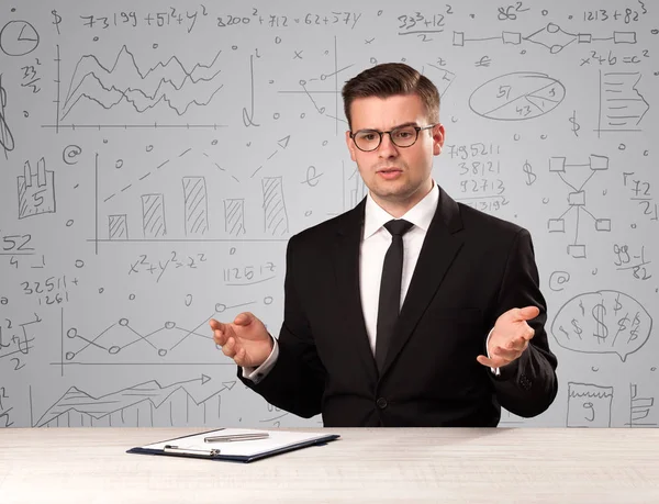 Businessman sitting at a desk — Stock Photo, Image