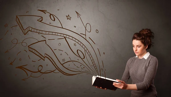 Young lady holding book with arrows — Stock Photo, Image