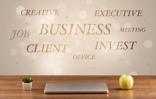 Business office desk with writing on wall — Stock Photo, Image