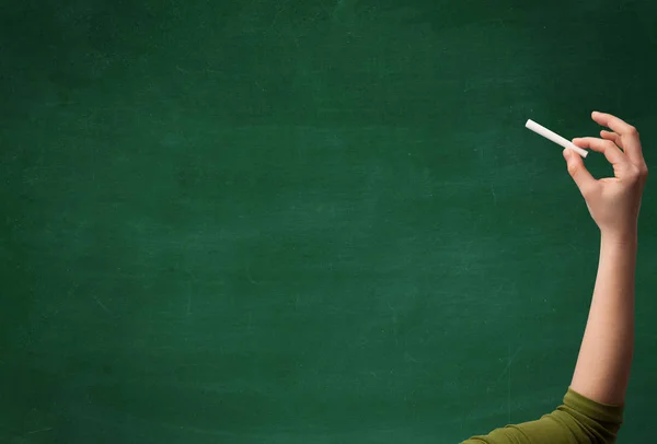 Hand writing on clean blackboard — Stock Photo, Image