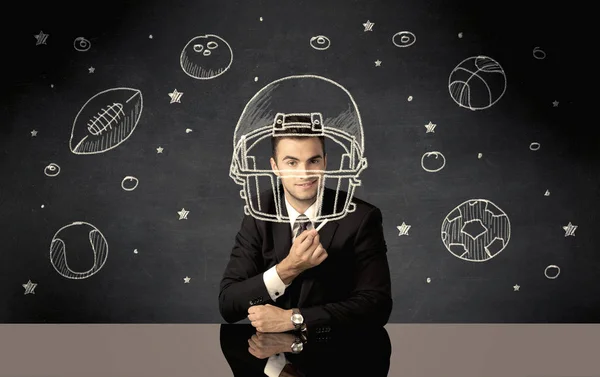 Empresário desenho capacete e bolas desportivas — Fotografia de Stock