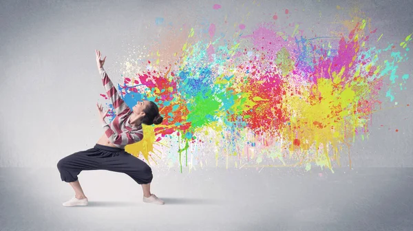 Young colorful street dancer with paint splash — Stock Photo, Image