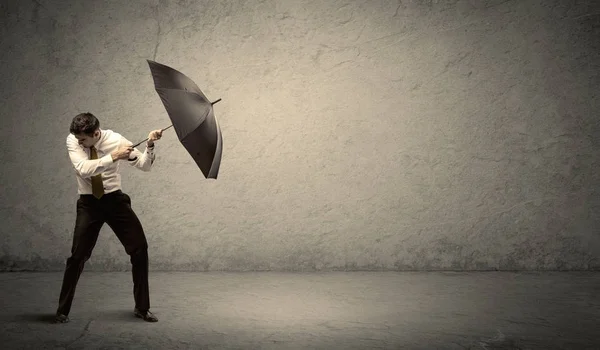 Handsome business man holding umbrella with copy space backgroun — Stock Photo, Image