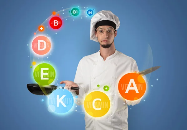 Handsome cook with vitamin concept — Stock Photo, Image