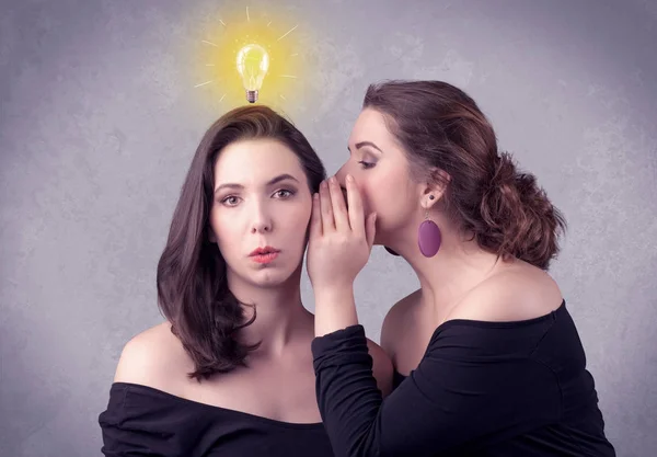 Girl telling secret things to her girlfriend — Stock Photo, Image