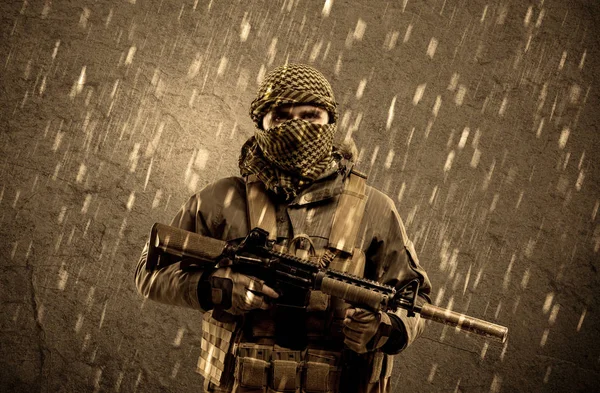 Dangerous heavily armed terrorist soldier with mask on grungy ra — Stock Photo, Image