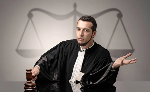 Young judge in gown deciding — Stock Photo, Image