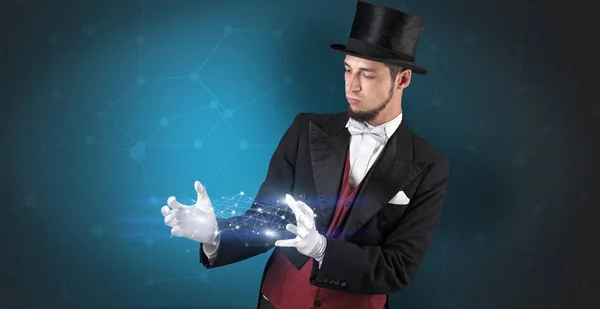 Kouzelník s geometrickou připojením na ruce — Stock fotografie
