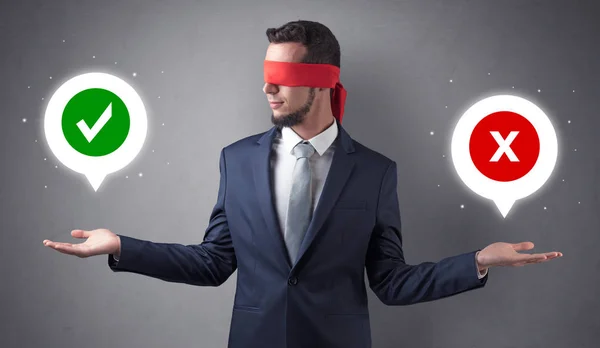 Blindfolded businessman trying to choose — Stock Photo, Image