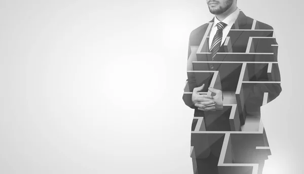 Businessman standing and thinking  with maze — Stock Photo, Image