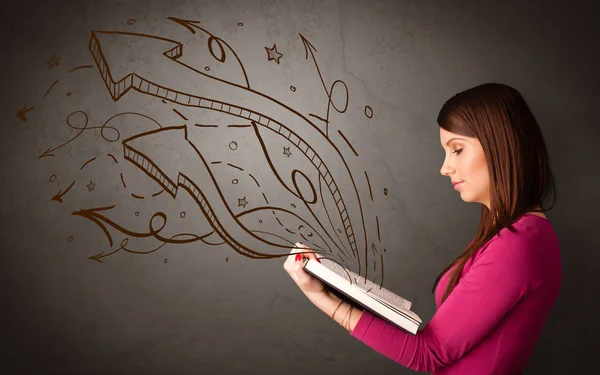 Young lady holding book with arrows — Stock Photo, Image