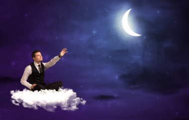  bulut üzerinde oturan işadamı