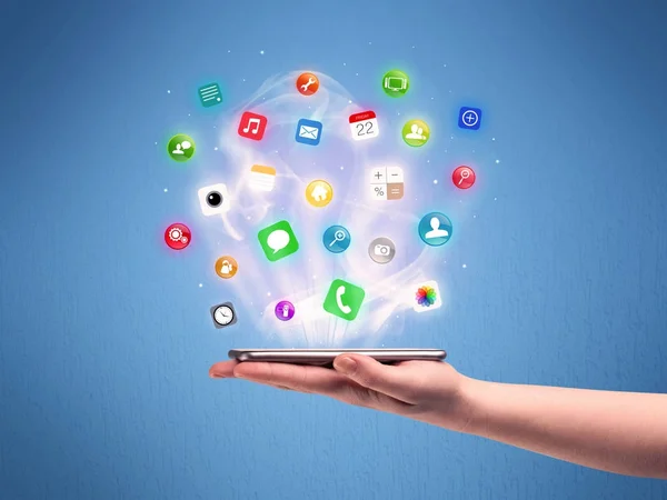 Hand holding tablet phone with app icons — Stock Photo, Image