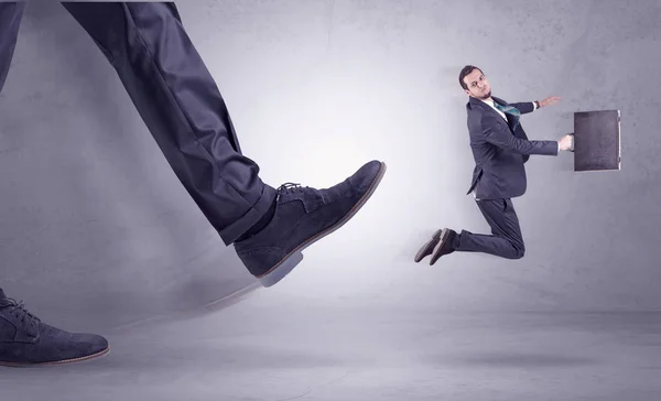 Foot kicking, businessman flying — Stock Photo, Image