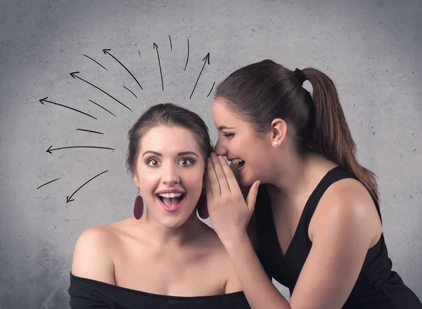 Girl telling secret things to her girlfriend — Stock Photo, Image