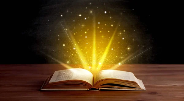 Yellow lights over book — Stock Photo, Image