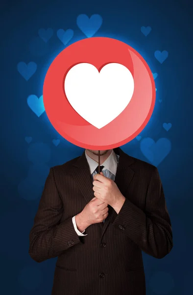 Businessman holding heart sign — Stock Photo, Image