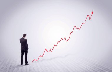 Kırmızı grafik ok ile ayakta işadamı