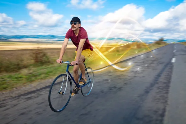 Magical young cyclist riding — Stock Photo, Image