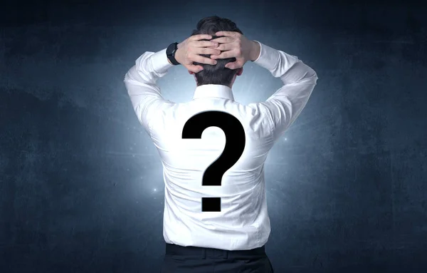 Man standing with question mark on his back — Stock Photo, Image