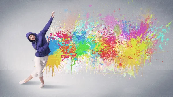 Young colorful street dancer with paint splash — Stock Photo, Image