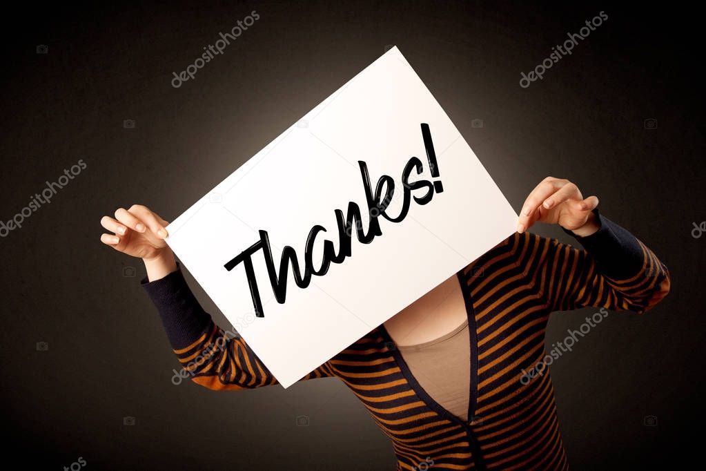 Woman holding paper expressing gratitude